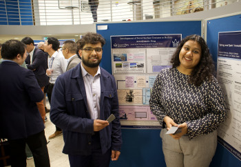 The prize winners Jarifa Tasnim Shah and Arrin Fernandes near their poster.