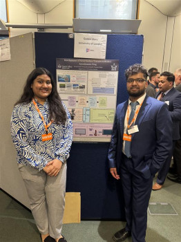 Jarifa and Arrin posing close to their poster