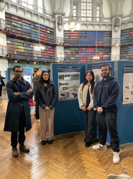 Tahsin Islam, Tasmia Butt, Nhu Nguyen, Kawshan Dhrubo (from left to right) standing close to their poster